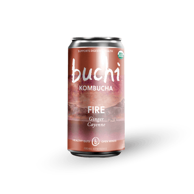 An 8 oz Buchi kombucha can with a copper label saying Buchi Kombucha Fire Ginger Cayenne 